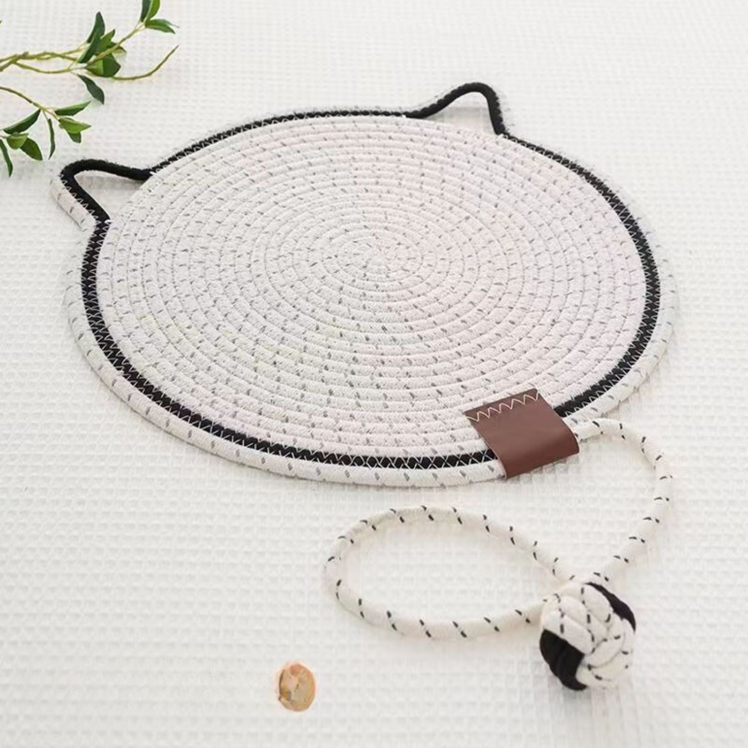 white round cat scratching mat with rope and toy